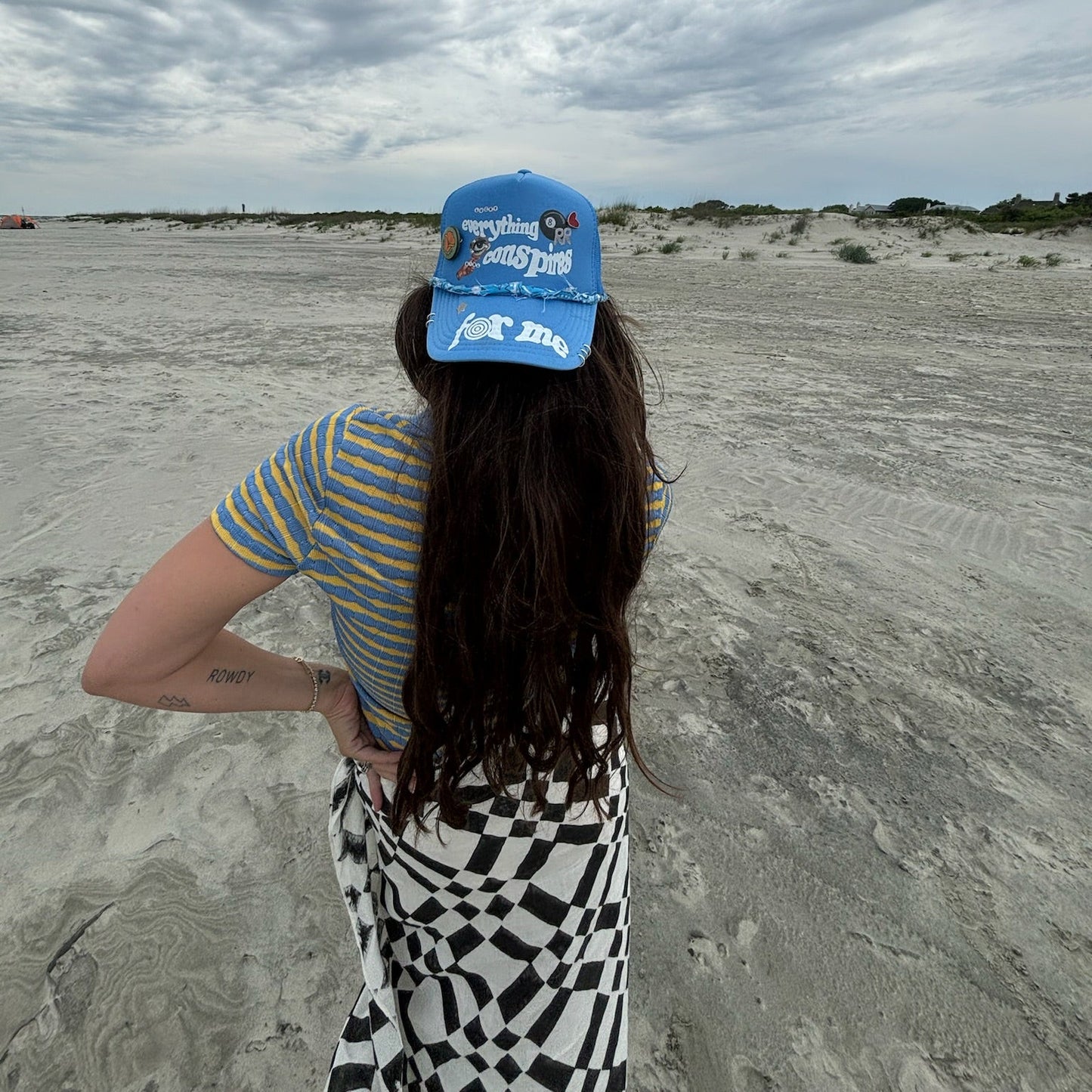 Everything Conspires Trucker Hat