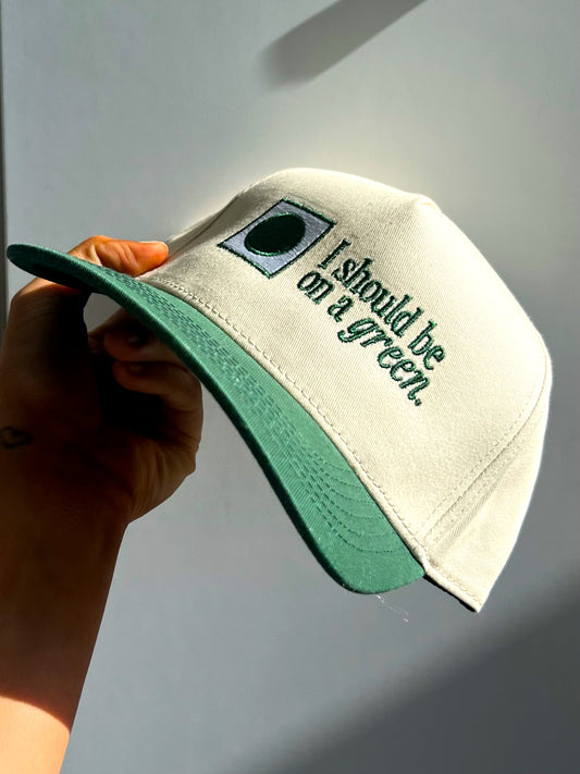 “I Should Be On A Green” Vintage Trucker Hat