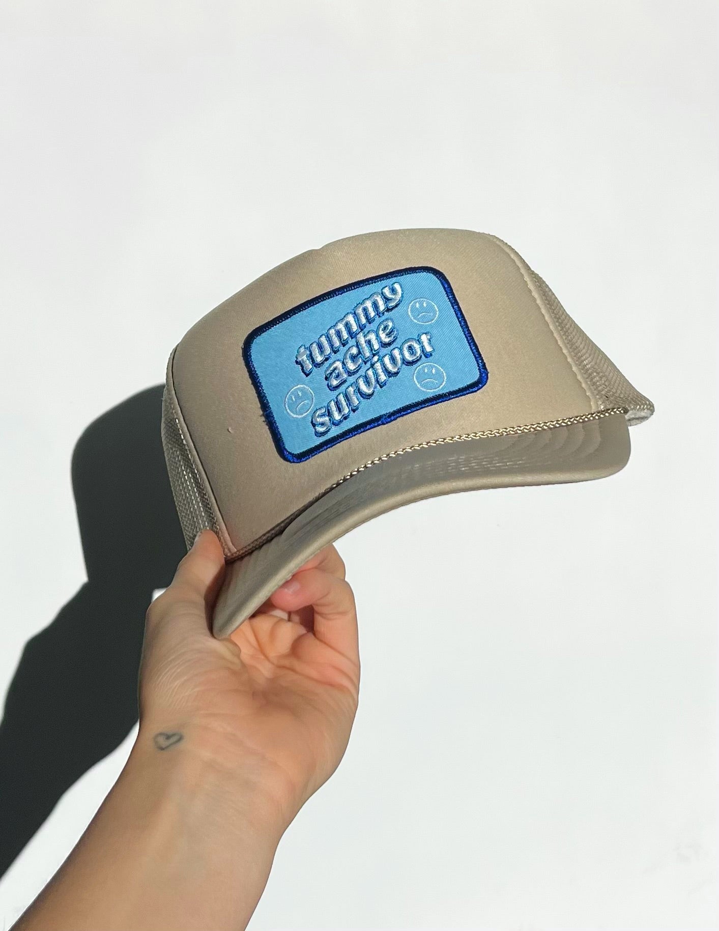 “Tummy Ache Survivor” Trucker Hat